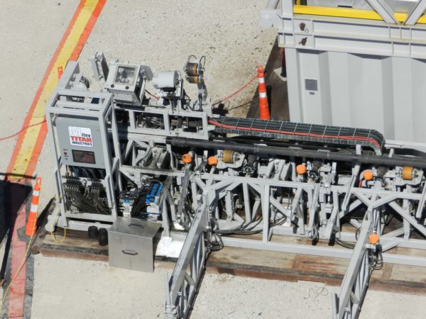 An image of a Ground Handling Systems: Ground Handling Systems are available in fully automated configurations. These systems are PLC-controlled for the efficient delivery of tubulars and also incorporate Robotic Pipe Handlers to enhance safety and efficiency when handling tubing